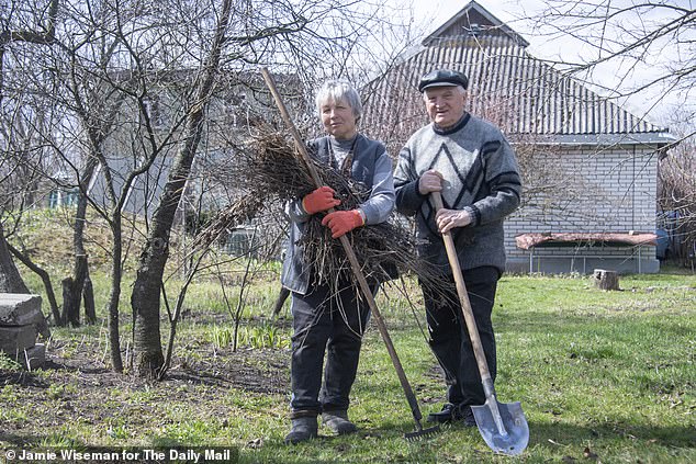 Anatolii and Nadi pictured at their dacha outside Kyiv, where they returned for the first time with the Mail since the start of the war, to check for damage and start planting this year's crops