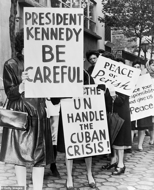 A group of protesters from Women Strike for Peace pictured holding placards in New York, in 1962