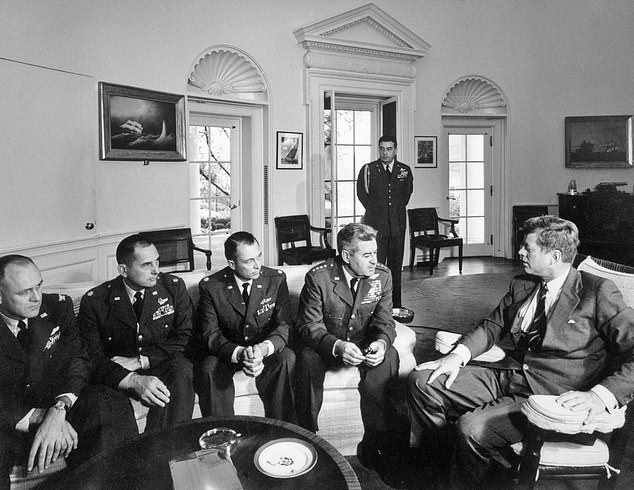 President Kennedy pictured discussing the surveillance of Cuba. When the Americans first spotted missiles with nuclear warheads on the ground in Cuba, the president and his advisers were in almost continuous session in the White House