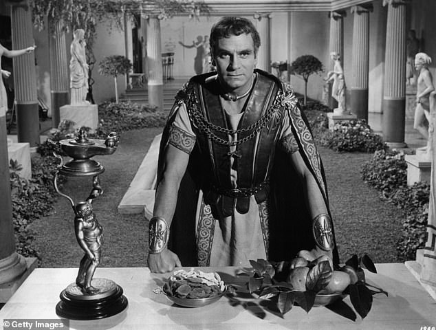 He was a hard, tough man, Marcus Licinius Crassus, a proper b*****d even by the standards of ancient Rome. Though you had to be tough to survive in those harsh days. Pictured: Laurence Olivier with fists clenched on table in a scene from the film 'Spartacus', 1960